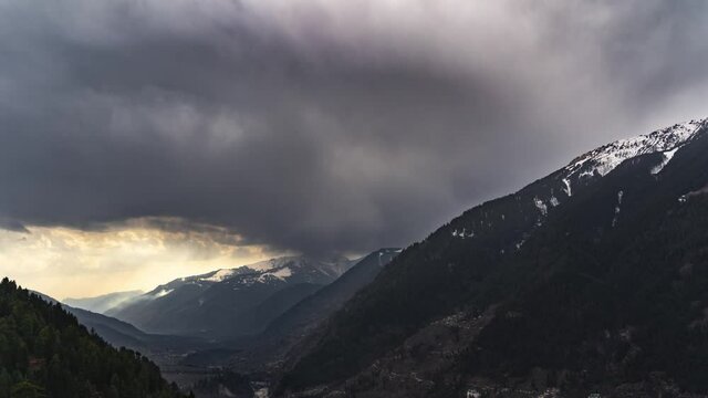 4K Timelapse stock video of clouds over snow mountains during monsoon near Kasol, Manali, Kullu, Himachal Pradesh Tourism, India