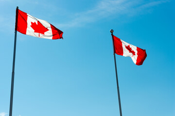 canadian flag against blue sky