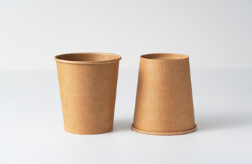 Disposable paper cups placed on a white background. Zero-waste concept.