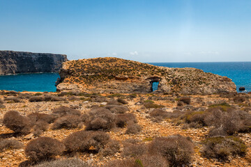 rocky beach with blue water