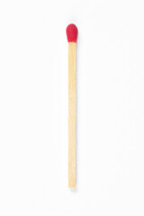 Top view close up macro photo of single matchstick isolated on white background. Smooth highlight and shadow by studio flash light.