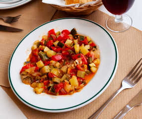 Healthy vegetable stew of zucchini, aubergine, tomato, onion and pepper