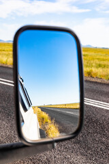 Vertical shot of a side mirror of a 4x4 vehicle © Michael Turner/Wirestock
