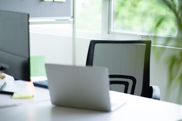 The table with the laptop on top
