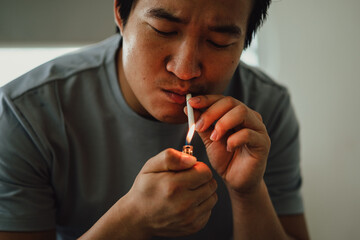 Asian man feels desperate for smoking addiction
