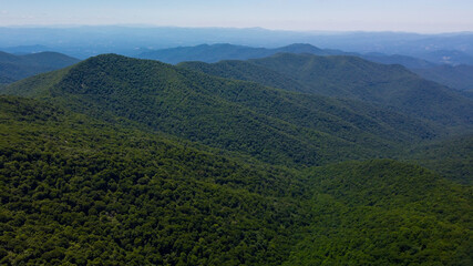 green mountain side with blue ridge