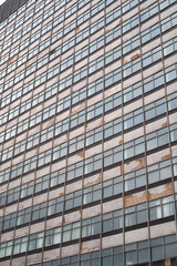 Fototapeta premium Close-up of weathered post-war modernist building exterior. 