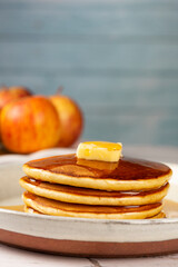 Delicious pancakes with butter and honey.