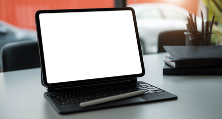 Blank screen Laptop computer and poster workspace background in modern office
