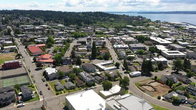 Cinematic 4K drone video of the downtown Edmonds commercial area, Kingston ferry terminal waterfront marina, near Seattle in Western Washington, Pacific Northwest, in Snohomish County