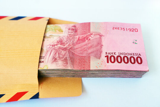 Indonesian rupiah banknote with image of female dancer in brown envelope, 100,000 rupiah