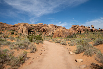 Scenery along the Devils Garden and Landscape Arch trail in Arches National Park in Utah on a sunny day