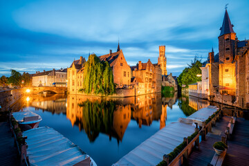 Brugge city centre, often referred to as The Venice of the North, with famous Rozenhoedkaai illuminated in beautiful twilight, West Flanders province, Belgium