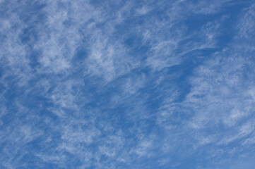 Blue sky with misty clouds