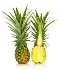 Pineapple and half pineapple isolated on white background