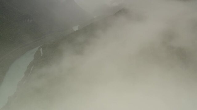 Large lake with Mounatins and fogy clouds, Aerial
Drone view over Soča river and mounains, Slovenia, 2021

