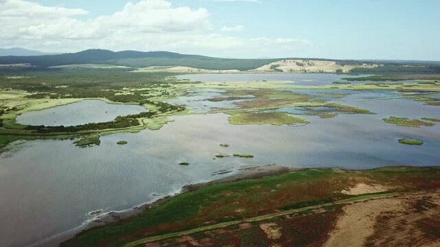 Aerial footage of the flood plains of the Lake Curlip Wildlife Reserve, alongside the Snowy River, near Marlo, in Gippsland, Victoria, Australia, December 2020