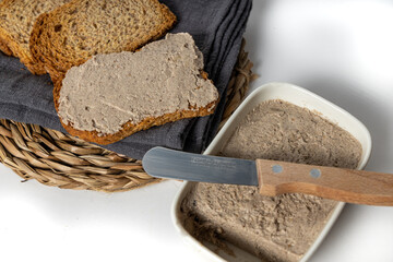 Closeup of the sliced bread covered with the delicious vegan mushroom and walnut pate