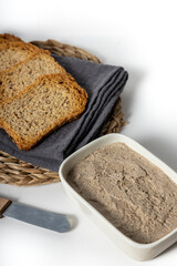 Closeup of the delicious vegan mushroom and walnut pate in the plate with slices of bread