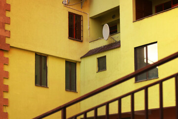 Fototapeta na wymiar Details of the facade of a yellow building