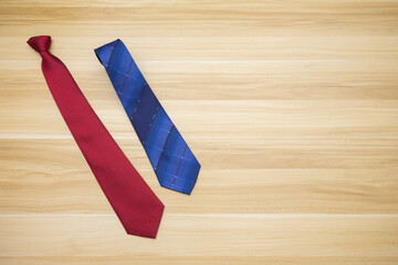 Happy family scene of one expanding tie and one tie gifts for father or dad in father's day with wood background