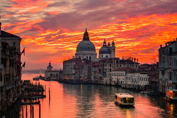 Obraz na płótnie Canvas Grand Canal and Basilica Santa Maria della Salute at sunset in Venice, Italy