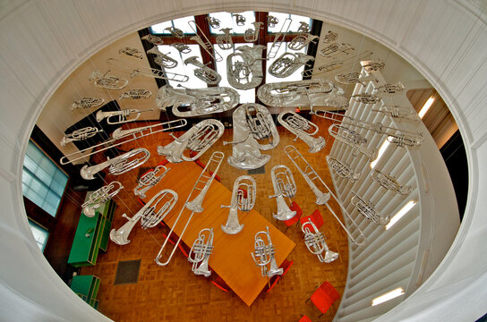 Art installation of flattened “silver” instruments called “Breathless” by Cornelia Parker between floors and can be enjoyed from above and below. Victoria and Albert Museum, London 