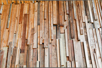 walls are made of teak - they are patched, nailed and glued to the walls to create different textures and look old.