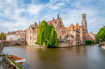 Fototapeta premium Bruges, Belgium. The Rozenhoedkaai canal in Bruges with the Belfry in the background