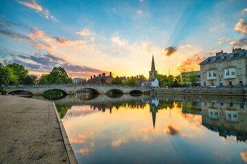 Fototapeta premium Bedford bridge at sunset with tower of St. Paul's church in the background 