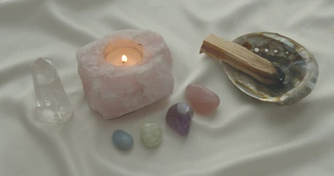 Rose Quartz Candle Magick Palo Santo smudge ritual with healing crystals