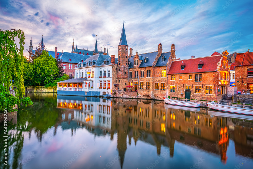 Poster Center of Brugge reflected in the water at sunset. Brugge is often referred to as The Venice of the North. Belgium