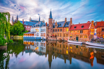 Obraz na płótnie Canvas Center of Brugge reflected in the water at sunset. Brugge is often referred to as The Venice of the North. Belgium