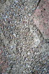 Natural pebble white, gray rough sand gravel concrete on background