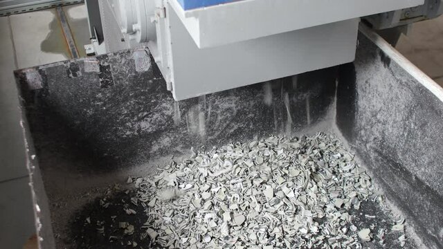 Plastic grinding process close up view of mill.