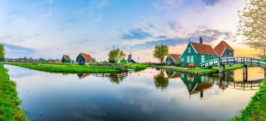 Sunset panorama of Zaanse Schans windmill village in Netherlands 