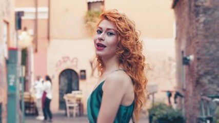 joy, happiness - woman walking in Trastevere makes a pirouette and smiles