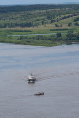 Nizhnekamsk, Tatarstan, Russia - 06.16.2021: Pusher vessel goes on the Kama river