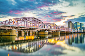 Obraz premium Jusoo bridge at sunrise near Yodogawa River in Osaka, Japan