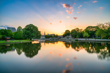 Fototapeta premium Great Ouse River overlooking tower of St Paul's church at sunset in Bedford. England 