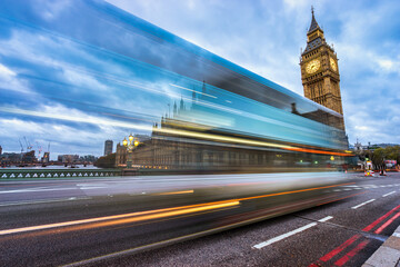 Fototapeta premium Big Ben at dawn with blurry bus in motion. Landmark of London