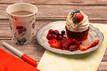 food photo on wooden background cupcake with berries and coffee breakfast
