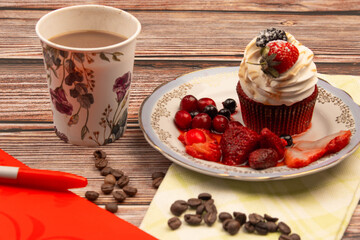 food photo on wooden background cupcake with berries and coffee breakfast