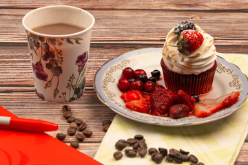 food photo on wooden background cupcake with berries and coffee breakfast