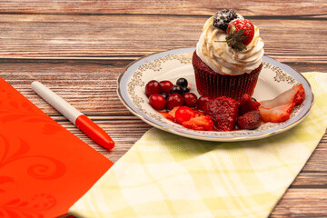 food photo on wooden background cupcake with berries and coffee breakfast
