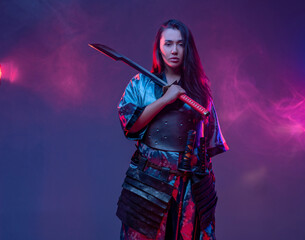 Woman dressed in samurai outfit with katana
