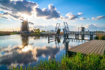 Kinderdijk windmill village at sunset in Netherlands 