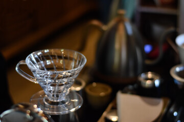 blur photo of hands drip coffee set in the coffee shop