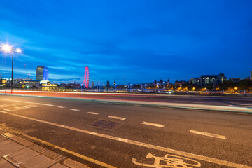 Waterloo Bridge overlooking skyline panorama of London at blue hour 