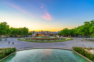Magic fountain at sunset near Spanish square in Barcelona, Spain